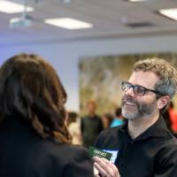 Two guests chatting at event